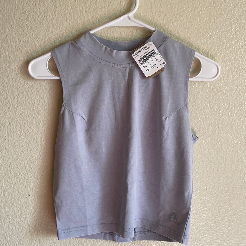 Two NTW Reebok crop tops